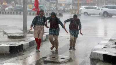 Monsoon update - heavy rain falling on agricultural fields in maharashtra.