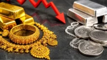 Todays Gold Rate jewelry display in a traditional Indian store with gold biscuits