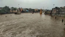 Nashik Rain Alert showing heavy rainfall and flooded service roads in Nashik.